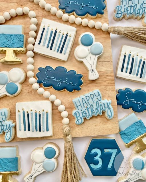 Elegant Birthday Cookies: A Whimsical Design in Calming Blue and White.