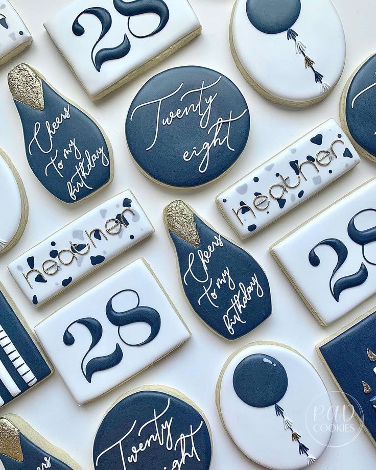 Elegant Navy Blue, White, and Gold Cookie Designs Perfect for Celebrations.