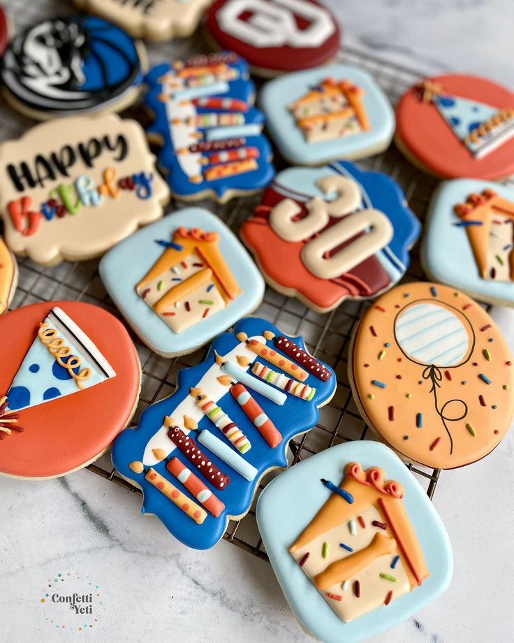 Whimsically Arranged Festive Birthday Cookies with Intricate Designs in Vibrant Colors.