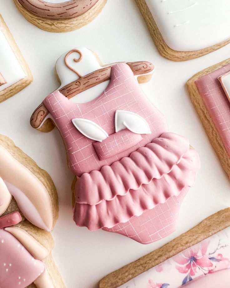 Charming Pink Dress Cookie Design with Playful Ruffles and Whimsical Aesthetic.