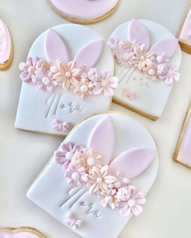 Charming Floral Cookie Designs with Whimsical Bunny Ears for Festive Celebrations.