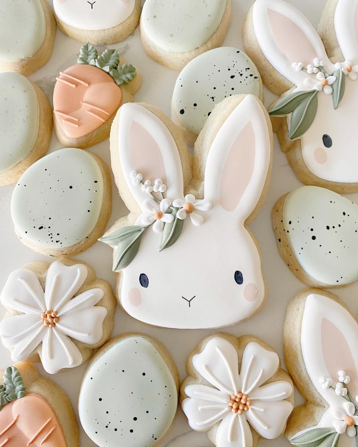 Charming Easter Cookies with Adorable Bunny and Floral Designs in Soft Pastel Colors.