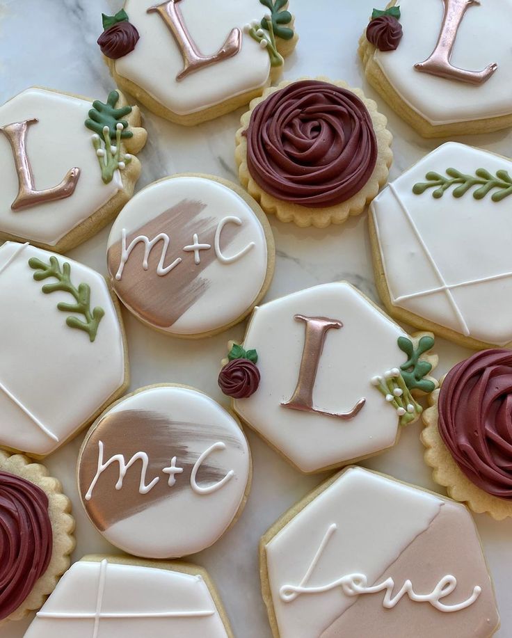 Chic Elegance: Exquisite Cookie Designs with Intricate Icing on Marble Display