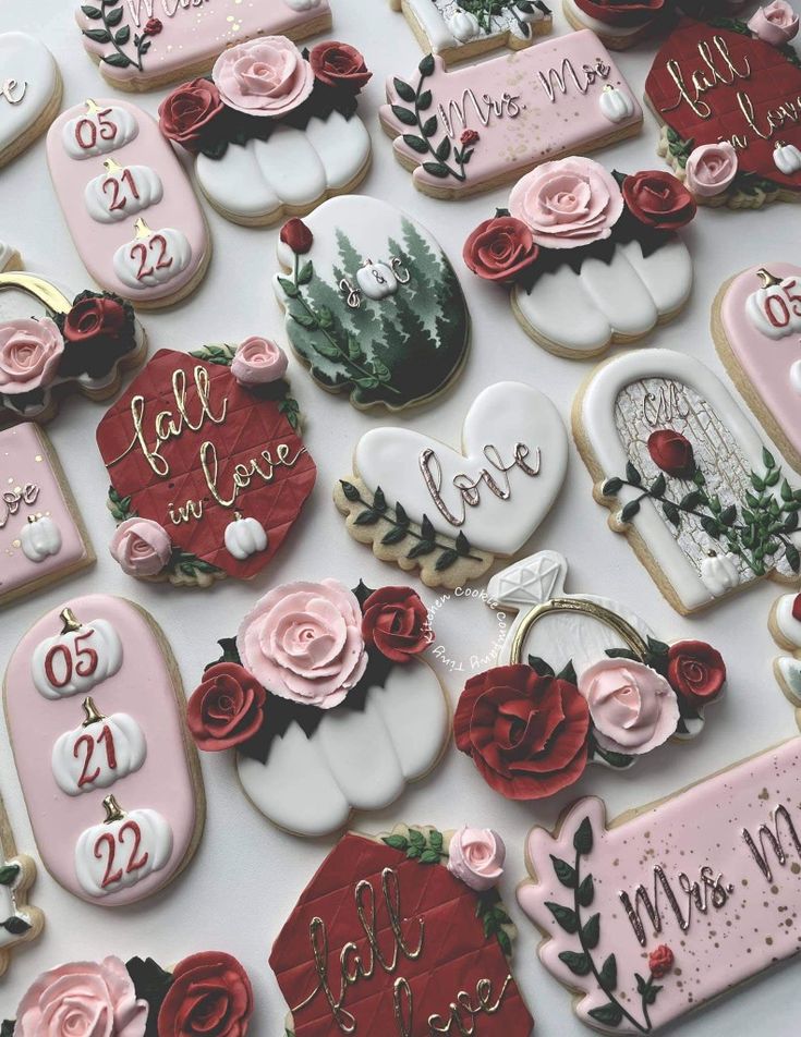 Romantic Floral-Themed Cookies in Soft Pink and Deep Red for Elegant Celebrations.