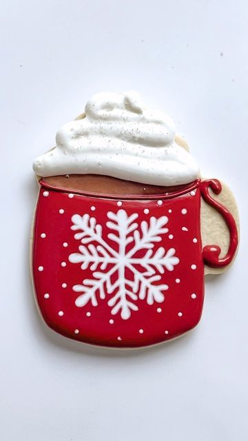 Whimsical Holiday Cookie Design: Cozy Mug with Whipped Cream and Festive Patterns.