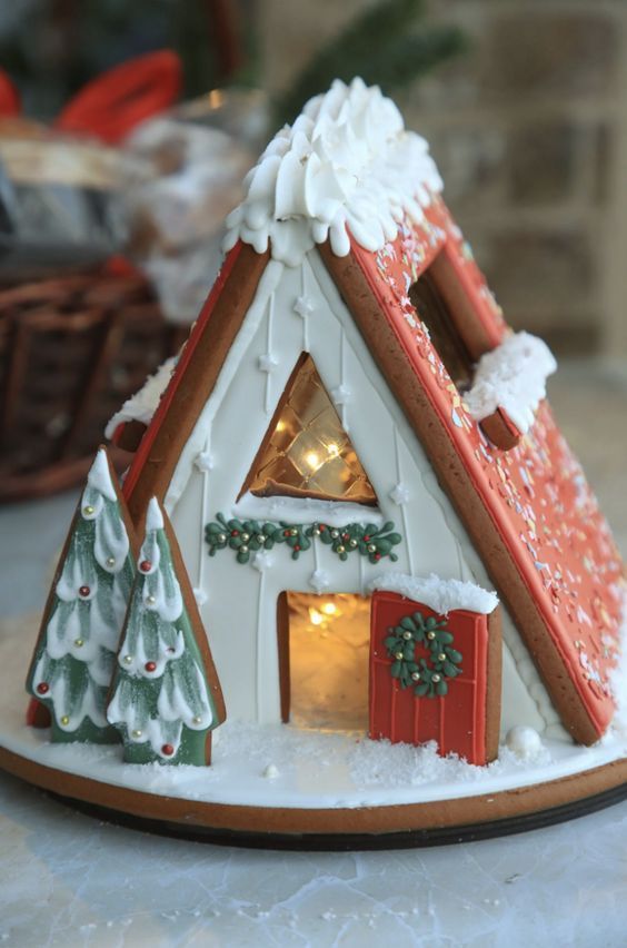 Charming A-Frame Gingerbread House with Festive Decor and Whimsical Holiday Ambiance