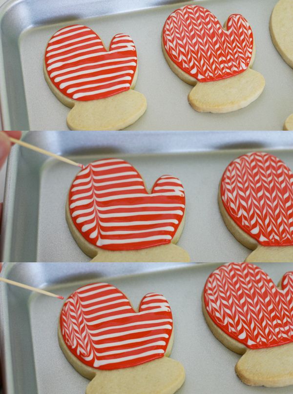 Creative Holiday Mittens: Festively Decorated Cookies with Bold Red Icing and Intricate Patterns.