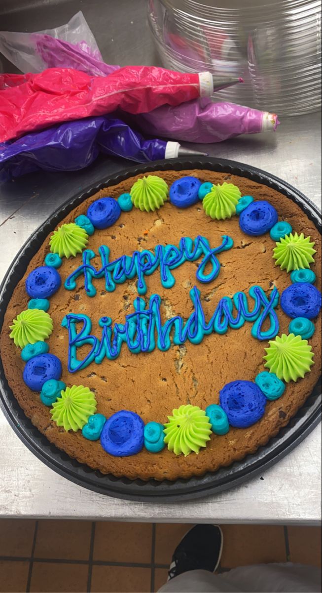 Festive Colorful Birthday Cookie Cake with Vibrant Icing and Decorative Frosting.