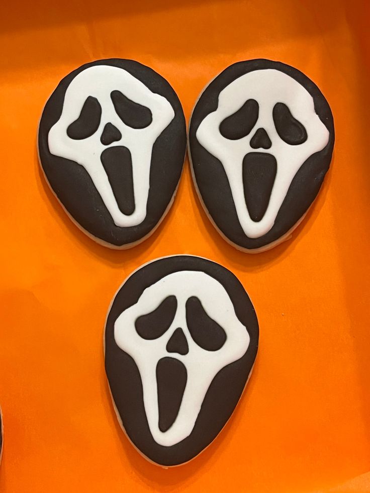 Iconic Horror-Inspired Themed Cookies: Striking Black and White Ghostly Designs for Halloween and Horror Movie Fans.