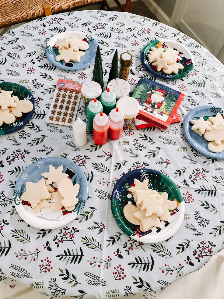 Festive Cookie Decorating Setup with Assorted Shapes and Colorful Frosting