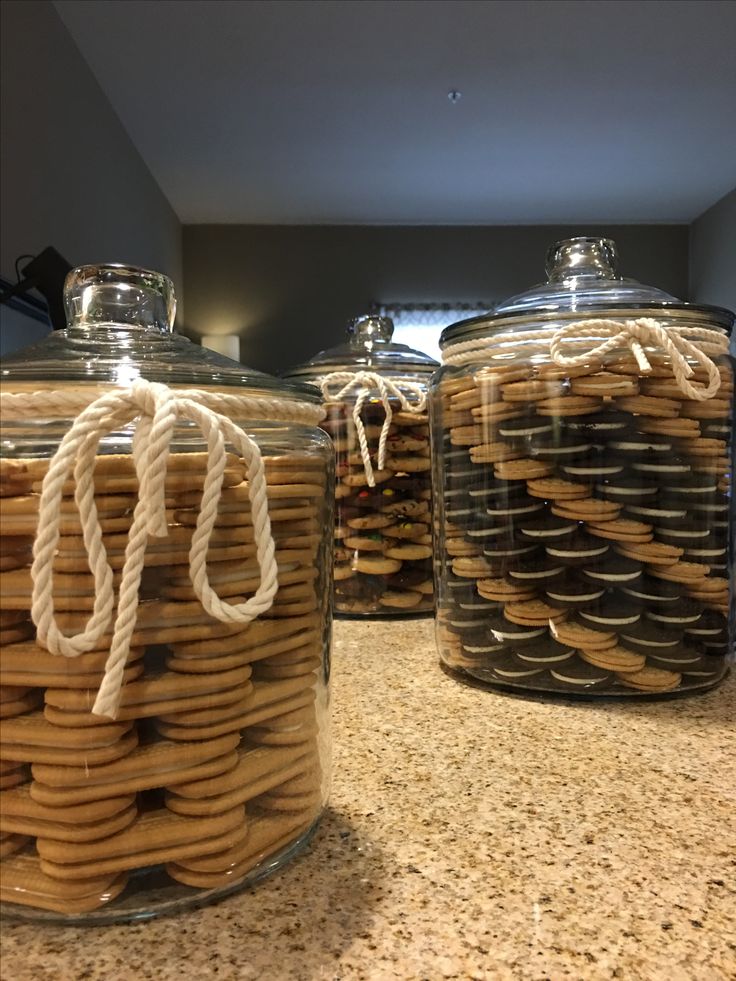 Charming Decorative Glass Jars of Colorful Cookies: A Delightful Kitchen Centerpiece.