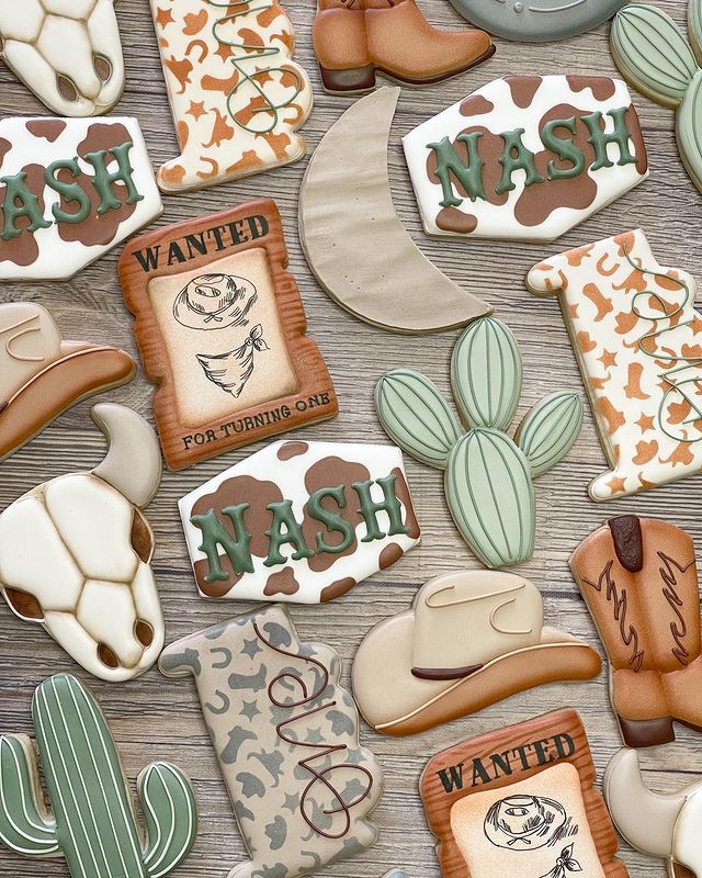 Playful Western-Themed Colorful Cookies with Cowboy Hats, Cacti, and Moon for a Rustic Celebration.