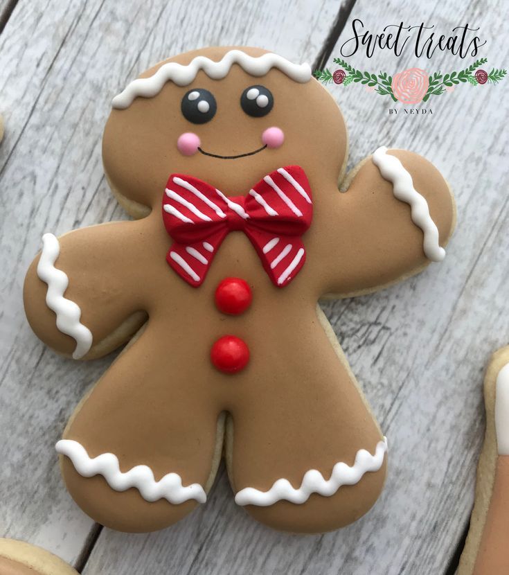 Cheerful Gingerbread Cookie Design with Red Bowtie and Icing Accents