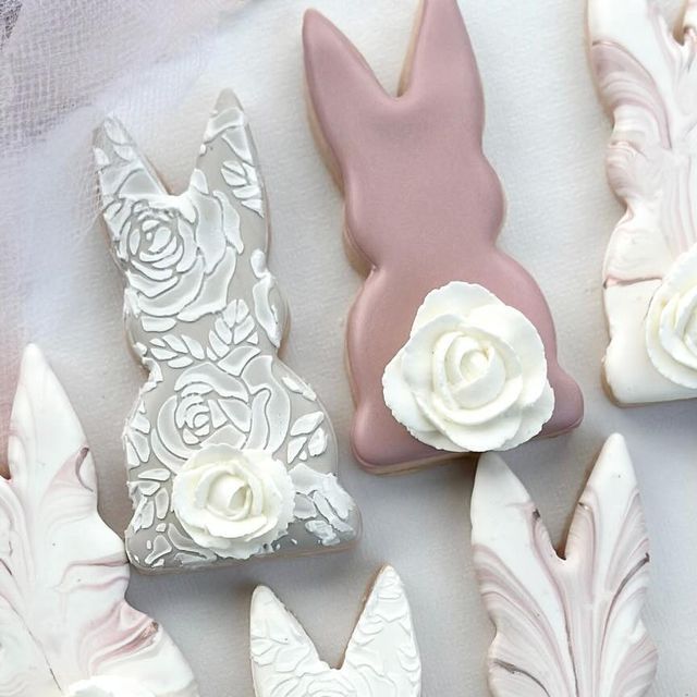 Elegant Bunny-Shaped Cookies with Floral Designs and Pastel Colors for Spring Celebrations.