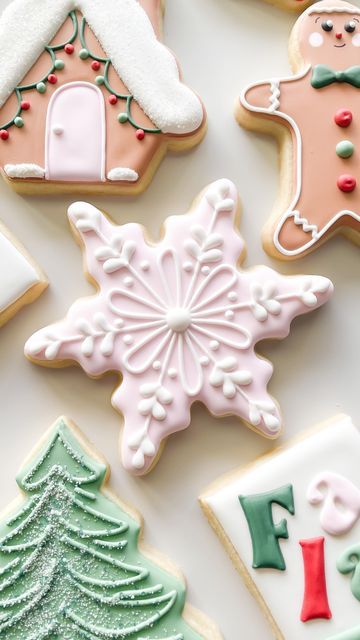 Intricately Designed Winter Cookies with Festive Snowflake Motif and Soft Pink Accents