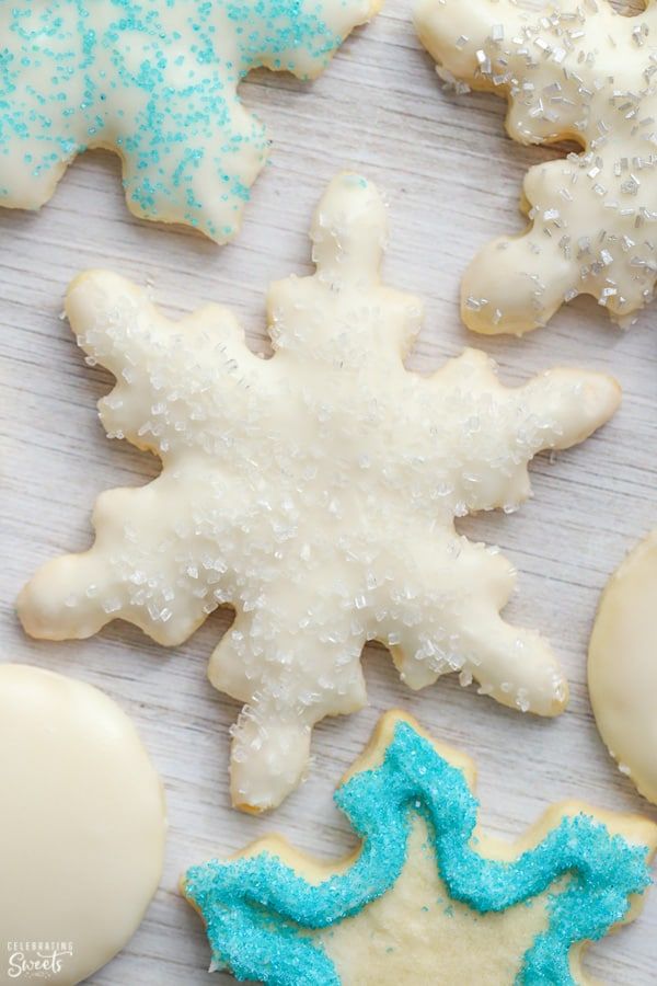 Elegant Winter Nail Designs Inspired by Cookie Shapes with Snowflake Patterns and Frosty Color Palettes.