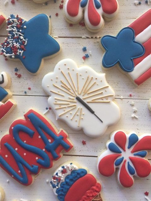 Festive Red, White, and Blue Cookies with Unique Designs and Shapes.