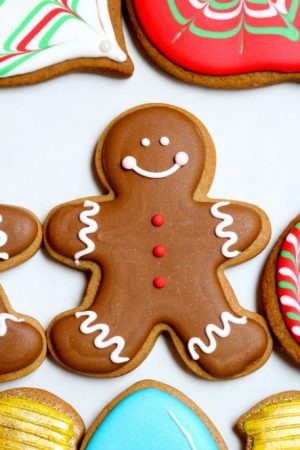 Festively Decorated Gingerbread Cookie Featuring a Cheerful Smiling Figure and Colorful Accents.