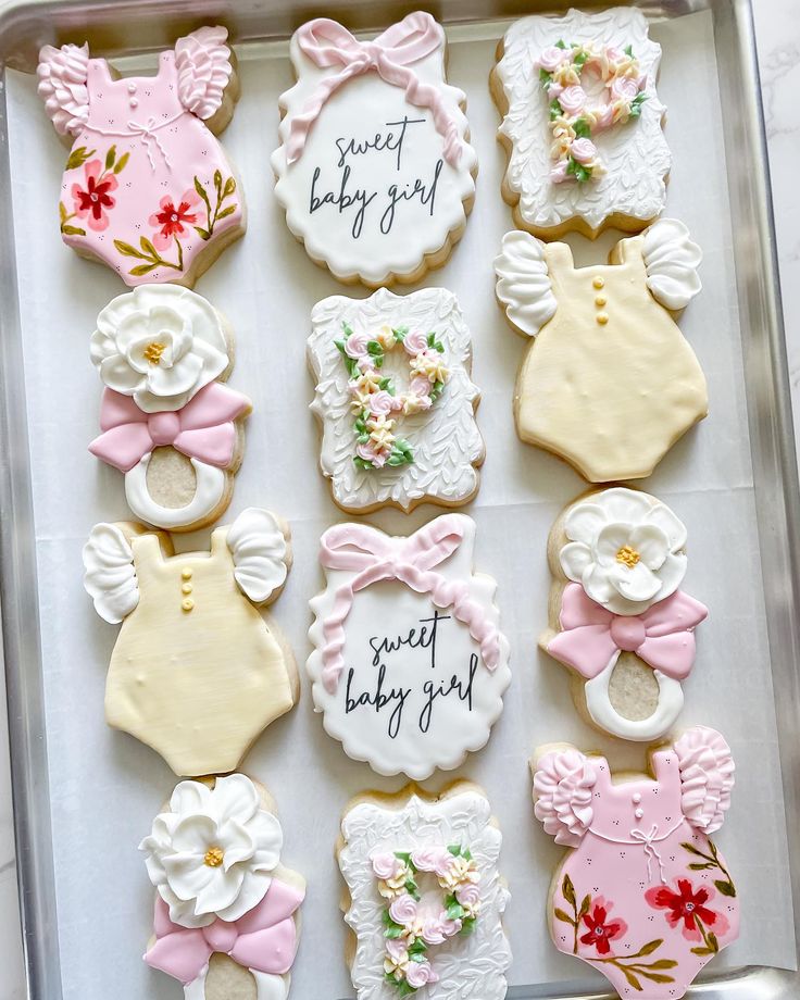 Whimsical Pastel Cookies for Baby Showers with Intricate Icing and Charming Designs.