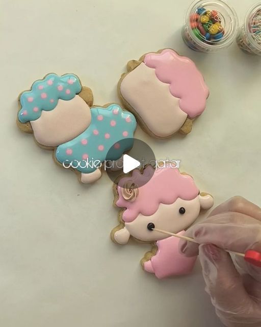 Playful Pastel Cookies: Whimsical Designs with Cupcake Motifs and Intricate Piping.