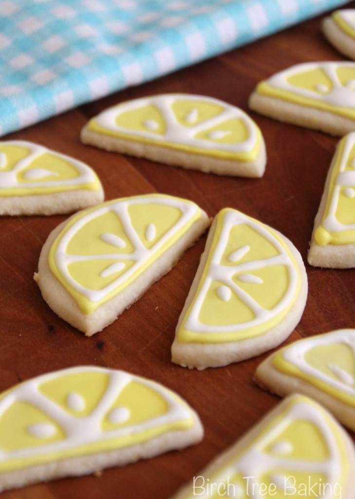 Vibrant Lemon-Shaped Cookies with Intricate Icing for Summer Celebrations.