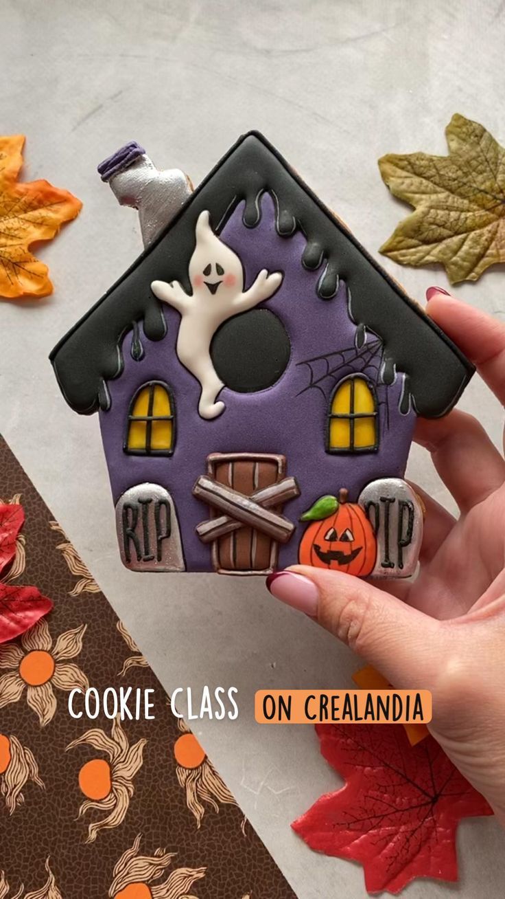 Charming Halloween Ghost House Cookie Design with Vibrant Colors and Playful Details.