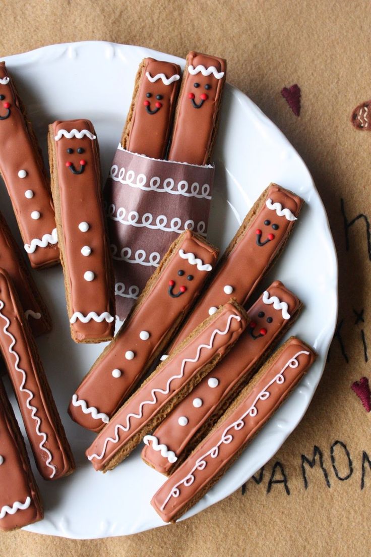 Festive Chocolate-Covered Gingerbread Treats with Whimsical Designs