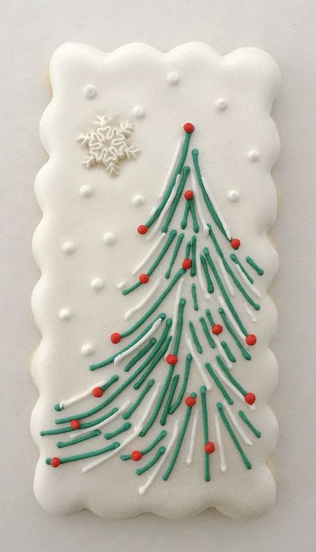 Charming Christmas Tree Cookie Design with Festive Icing and Snowflake Accents.