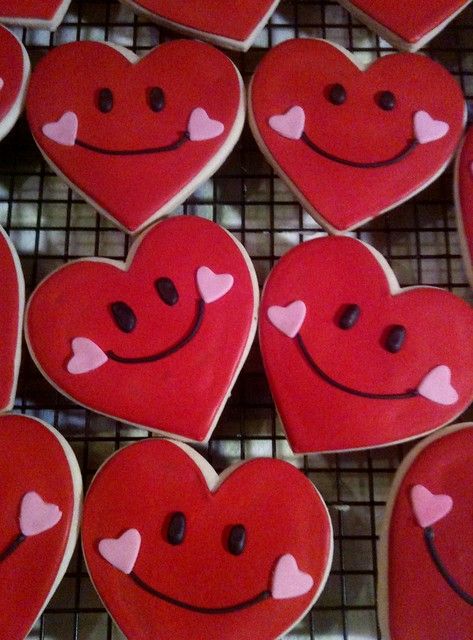 Joyful Heart-Shaped Cookies with Bright Smiley Faces and Whimsical Icing.