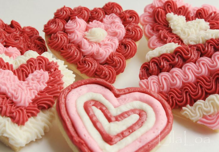 Festive Heart-Shaped Cookies with Intricate Icing in Romantic Colors.