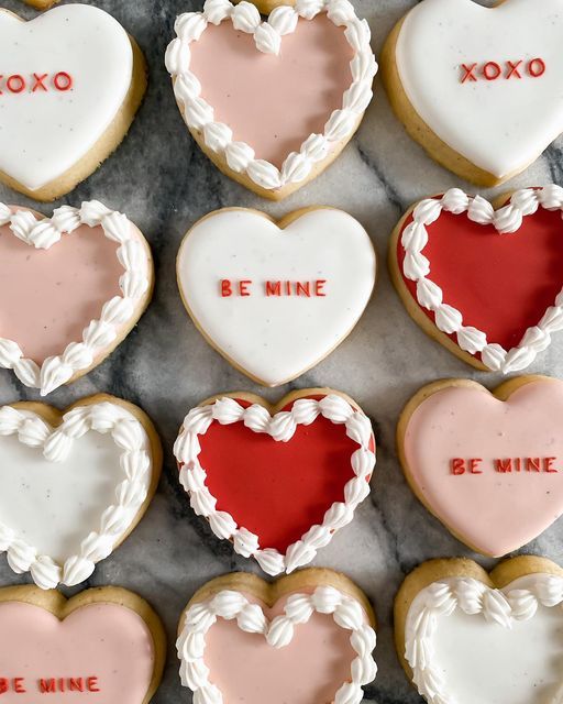 Festive Heart-Shaped Cookies with Whimsical Icing Designs for Celebrating Love.