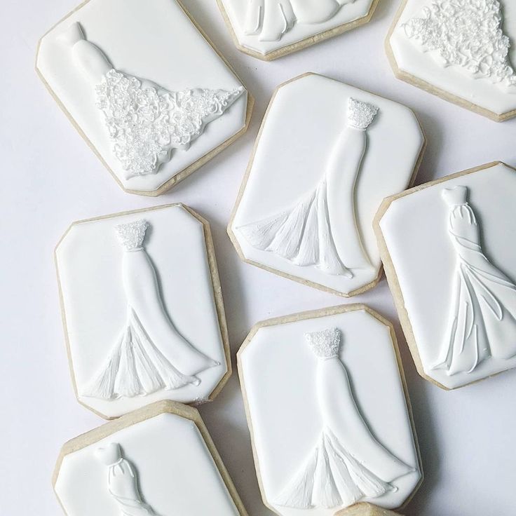 Chic Wedding Dress-Inspired Cookies with Intricate Designs for Celebrations.