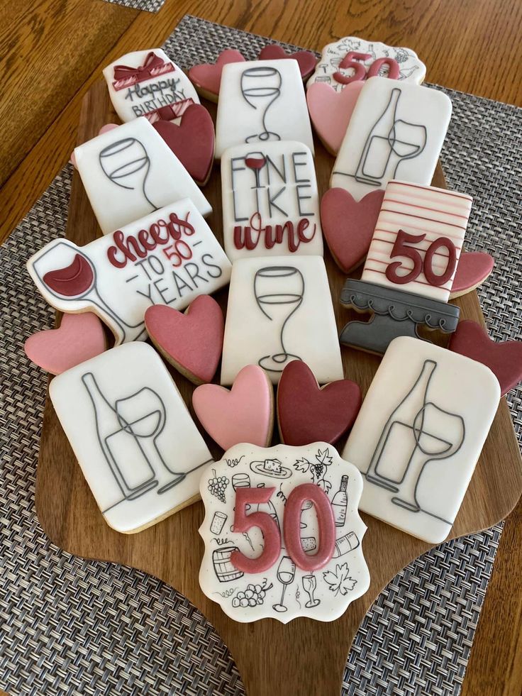 Vibrant Cookie Platter: Festive Designs for Celebrations with Wine Glasses and Hearts.