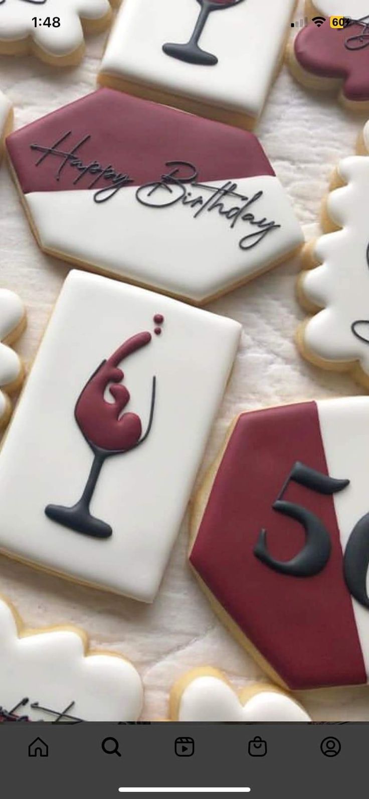 Elegant Decorative Cookies with Wine Glass and Festive Shapes in Rich Reds and Whites.