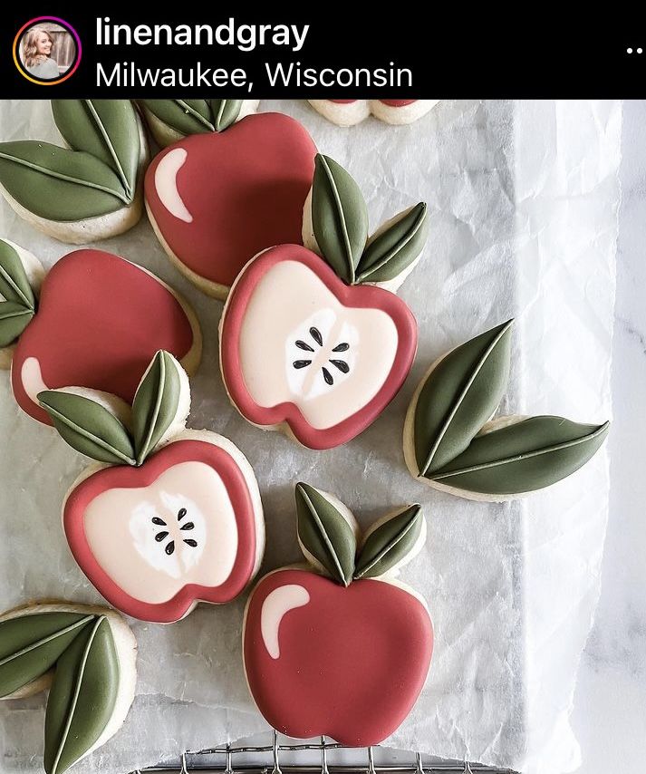 Whimsical Apple-Shaped Cookies Decorated with Vibrant Icing for Festive Gatherings.