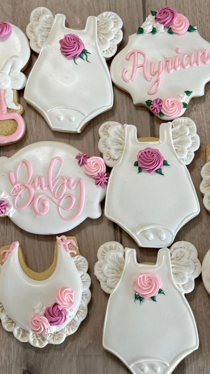 Charming Baby-Themed Decorative Cookies with Elegant Onesie Designs for Special Occasions.