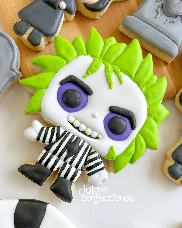 Whimsical Halloween Cookie Design: Vibrant Character with Spiky Green Hair and Striped Outfit