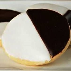 Elegant Bicolor Cookie Design: Inspiring Chic Black and White Nail Art.