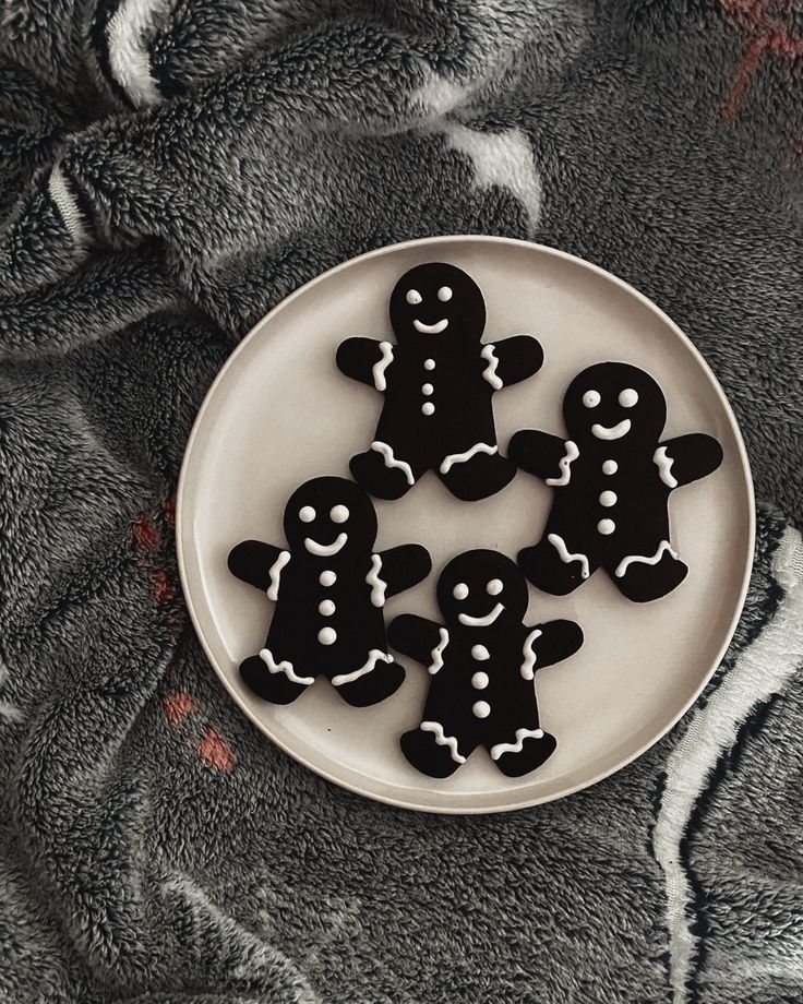 Whimsical Black and White Gingerbread-Inspired Nail Designs for a Festive Twist.