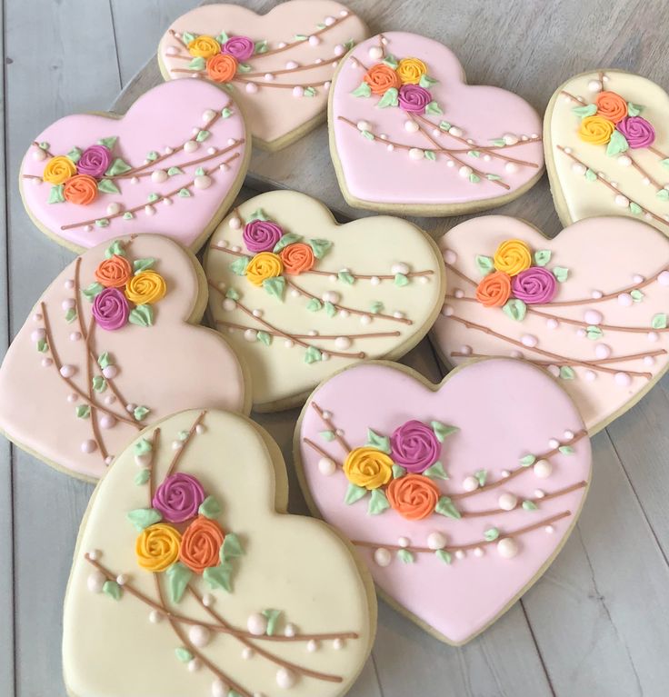 Elegant Heart-Shaped Cookies: Soft Pink and Creamy White with Floral Designs and Edible Pearls