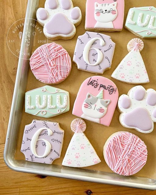 Playful Themed Colorful Cookie Designs with Personalized Cat Motifs and Festive Elements.