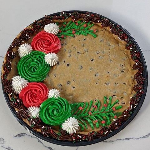 Vibrant Festive Cookie Cake with Floral Icing Decorations and Chocolate Chip Base