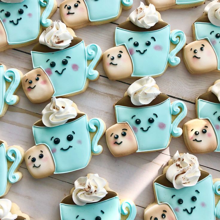 Whimsical Pastel Cookie Designs: Smiling Mugs and Marshmallows for Cozy Celebrations