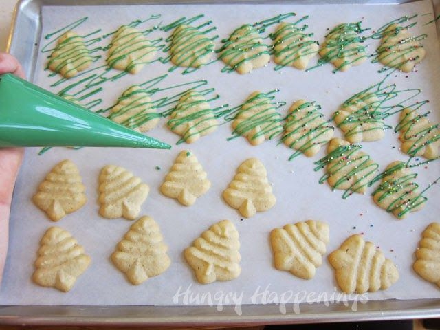 Festive Cookie Decorating: Shaped Christmas Trees with Intricate Icing and Piping Bag.