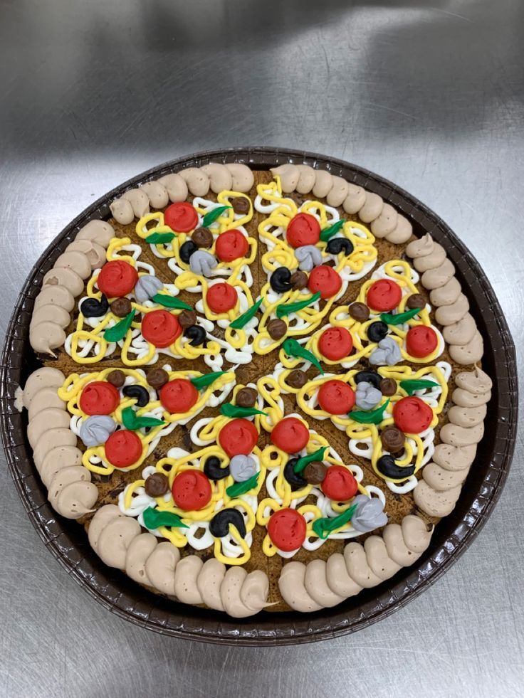 Vibrant Dessert Pizza Adorned with Icing Toppings and Charming Piped Frosting