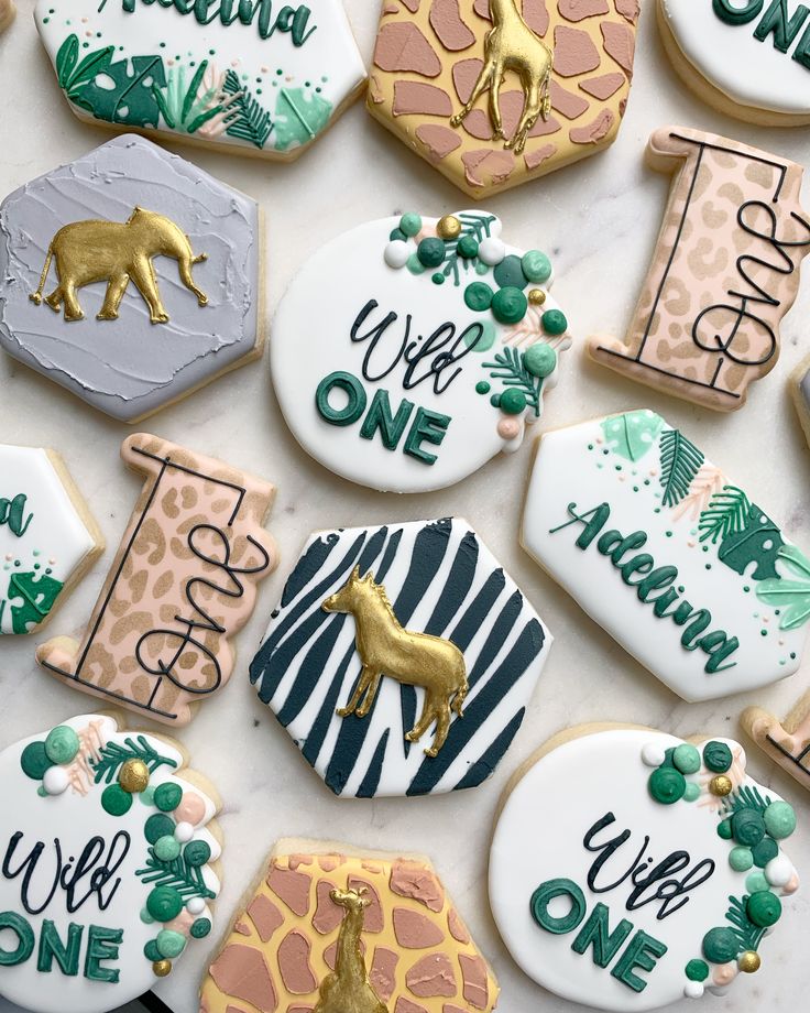 Vibrant Animal-Themed Cookies with Intricate Designs and Gold Accents for Festive Celebrations.