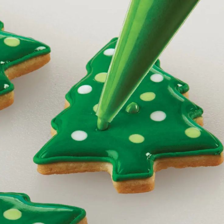 Festive Green Christmas Tree Cookies with Polka Dot Icing.