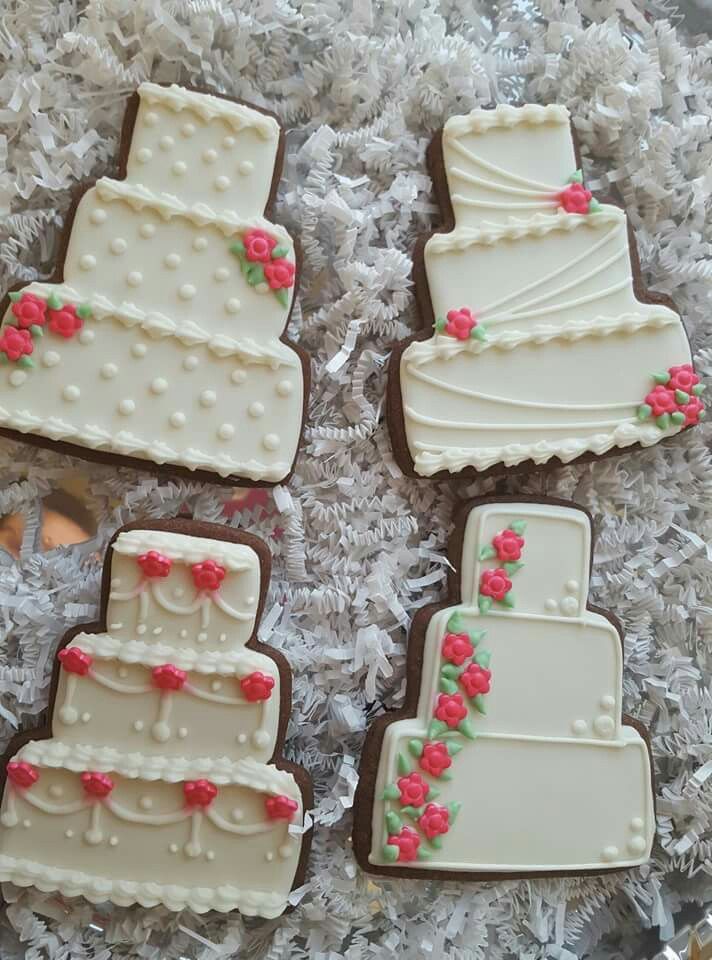 Whimsical Wedding Cake Cookies: Intricate Icing and Floral Accents for Celebrations.