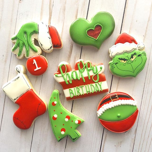 Festive Display of Colorful Holiday Cookies Featuring Santa, Christmas Trees, and the Grinch.