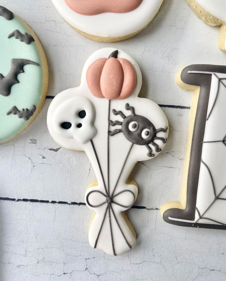 Whimsical Halloween-Themed Cookie Design: Playful Pumpkin, Skull, and Spider Elements